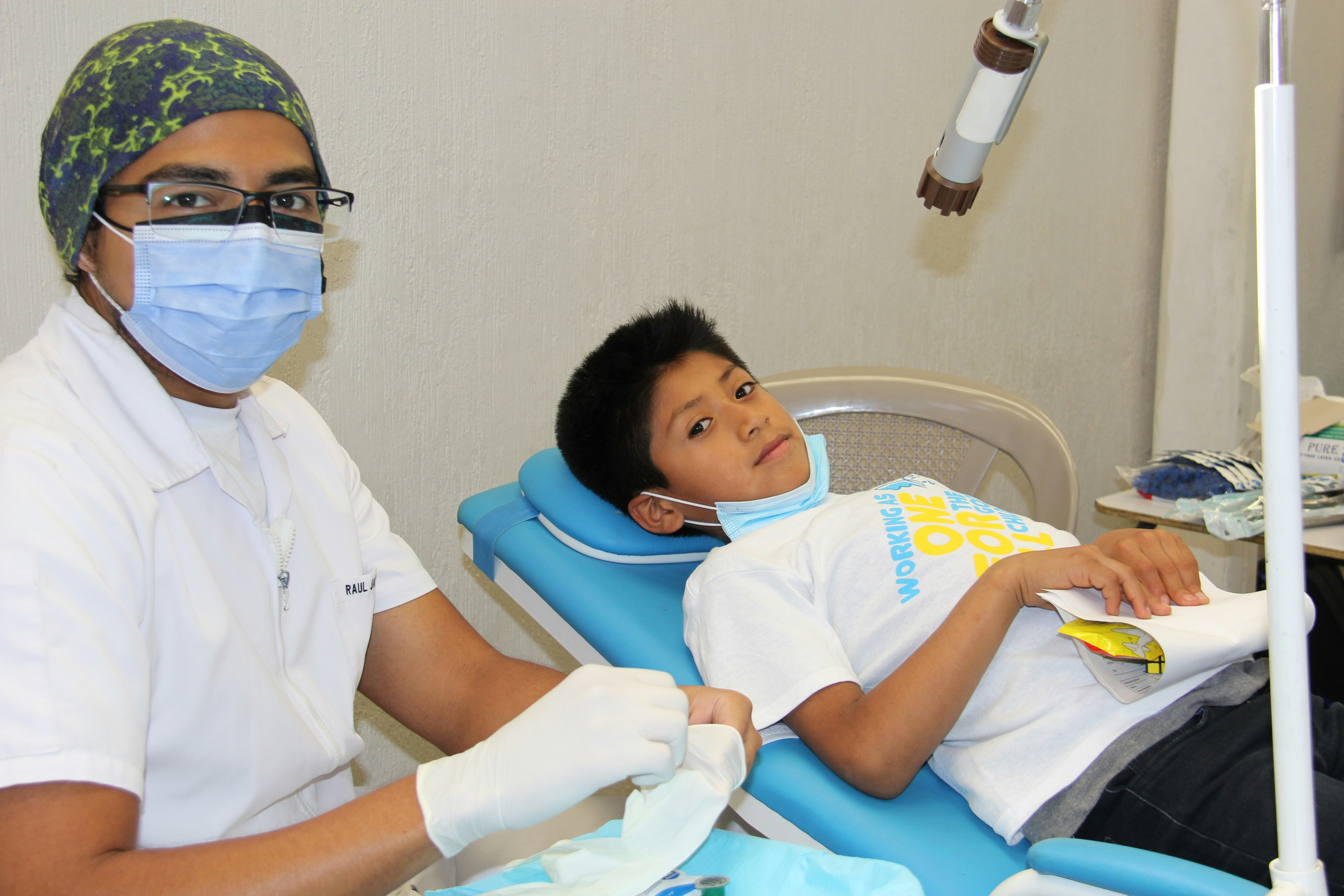 Happy child receiving gentle pediatric dental care for healthy development